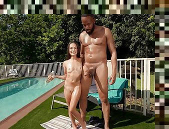 Nude romance by the pool grants this petite babe the ultimate interracial thrills