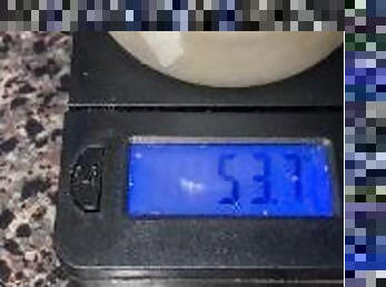 A couple ounces of my cum!!!! Weighing my frozen cum loads on a scale-53.7grams