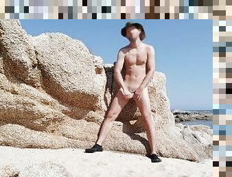 Slim hunk caught while jerking by the sea